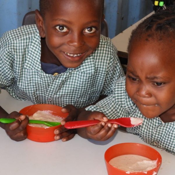 Brother and sister enjoying their meal at break time